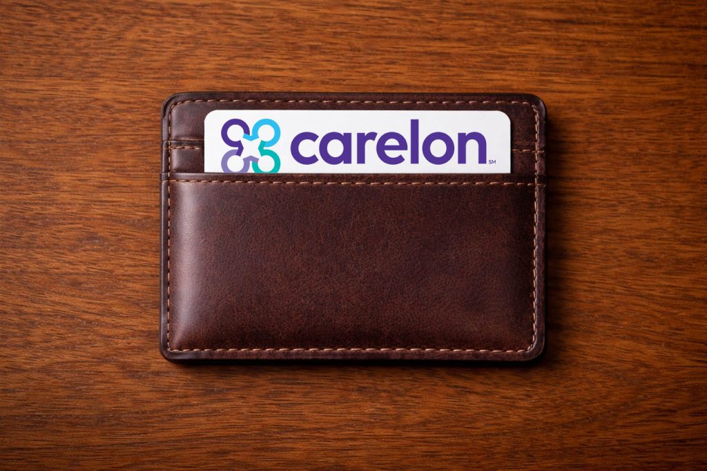 A wallet with a Carelon health insurance card showing